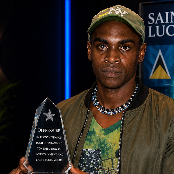 DJ Pressure from Saint Lucia holding an award